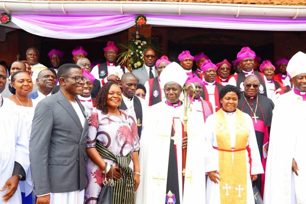 Rt Rev Bishop Moses Banja in the middle with his wife Image